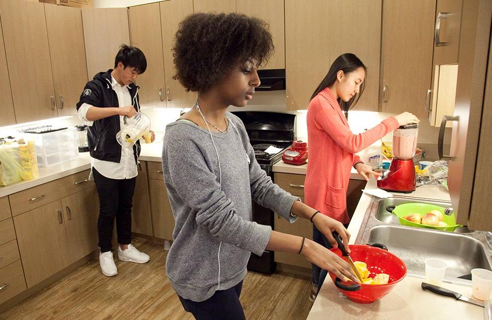 students cooking in dorm kitchen