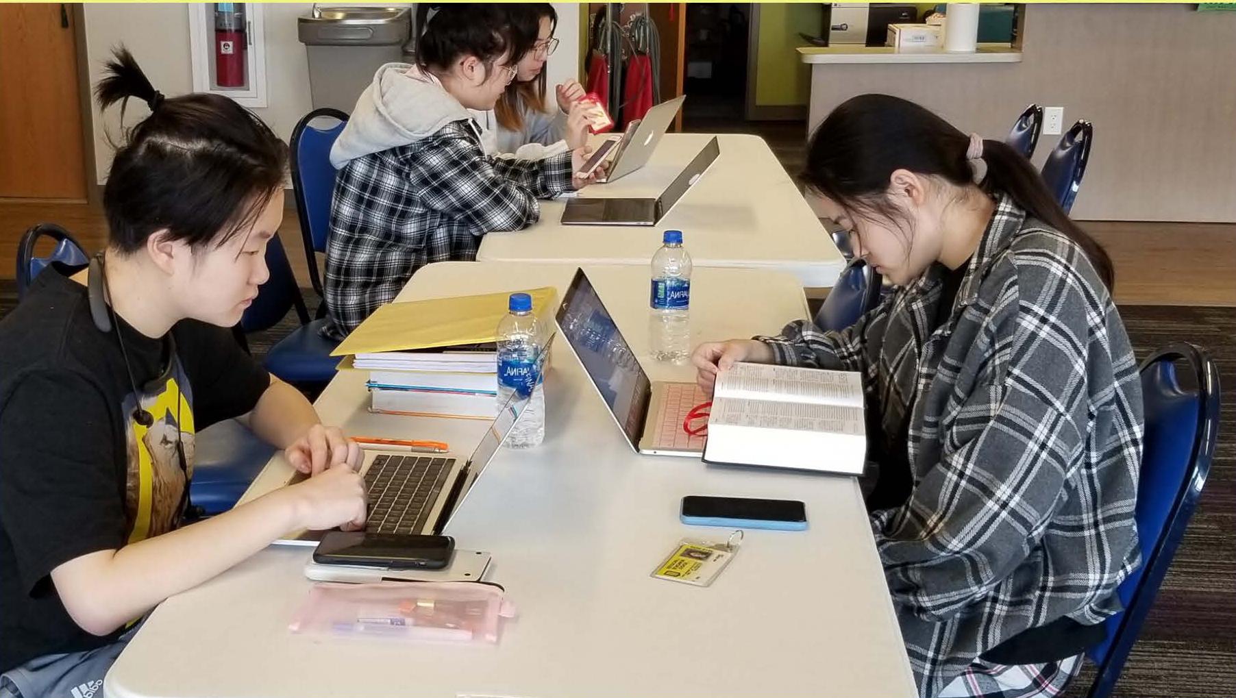 students studying at a table